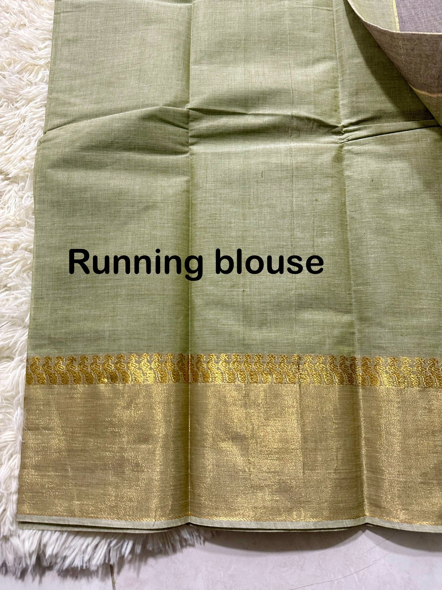 Pastel green cotton saree with gold jari